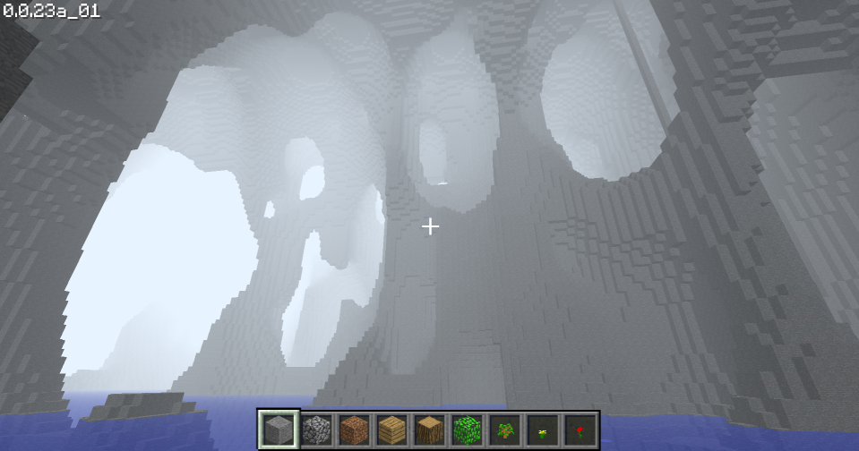 A Minecraft screenshot showing huge stone caves that enclose the whole map with an underground lake and white fog.