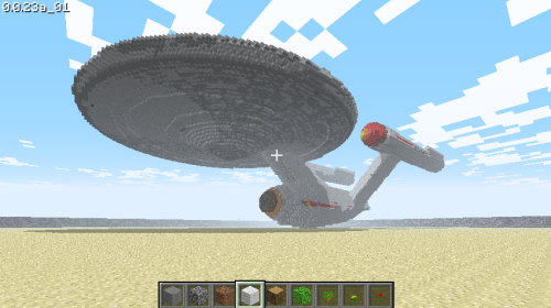 A map of the original USS Enterprise on a sandy base.